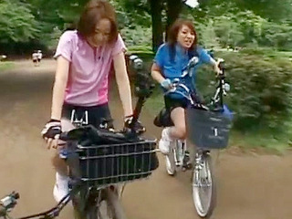 Get ready for a wild ride with 2 hot Japanese babes - Anri Hiramatsu and Rina Yuuki - as they fuck their wet pussies on a bike ride in Tokyo, Japan.